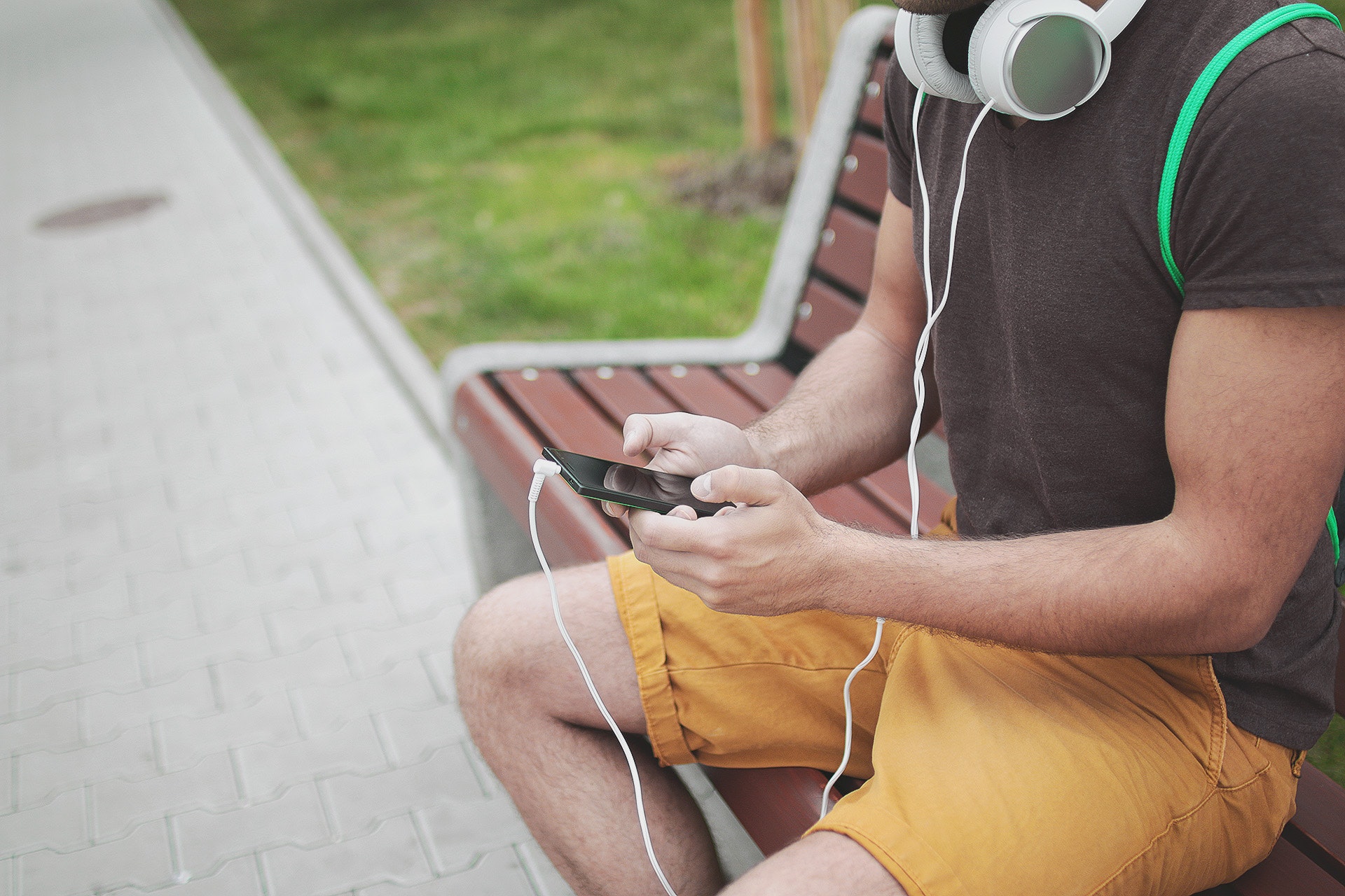 man-listening-to-radio-on-mobile-phone